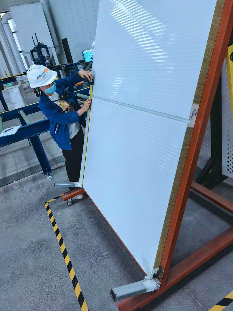 This image shows sandwich panel dimensional inspection.